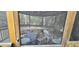 Interior view of a screened gazebo featuring a dining set and chairs at 1055 & 1075 Yorkshire St St, Port Charlotte, FL 33952