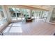 Bright living room with tiled floors and many windows, showcasing backyard views and a comfortable seating area at 1055 & 1075 Yorkshire St St, Port Charlotte, FL 33952