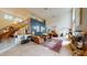 Spacious living room with a high ceiling, fireplace, stairs, and an open layout at 1055 & 1075 Yorkshire St St, Port Charlotte, FL 33952