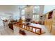 Open living room with high ceilings, large windows, and a cozy fireplace feature at 1055 & 1075 Yorkshire St St, Port Charlotte, FL 33952