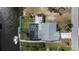 Aerial view of the home highlighting the pool, boat dock, and waterfront access at 129 Barre Nw Dr, Port Charlotte, FL 33952