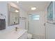 Well-lit bathroom features a walk-in shower with a glass door and vanity at 129 Barre Nw Dr, Port Charlotte, FL 33952