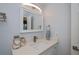 Bathroom featuring white vanity with quartz countertop and ample mirror space at 129 Barre Nw Dr, Port Charlotte, FL 33952