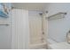 Full bathroom with shower/tub combo, light walls and tile, and brushed nickel hardware at 129 Barre Nw Dr, Port Charlotte, FL 33952