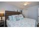 Tranquil bedroom features a ceiling fan, large bed, and a coastal-themed decor at 129 Barre Nw Dr, Port Charlotte, FL 33952