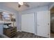 Cozy bedroom with a neutral palette and view out to swaying palm trees through window at 129 Barre Nw Dr, Port Charlotte, FL 33952