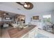 Inviting dining area open to the kitchen and living room, featuring a rustic wood table at 129 Barre Nw Dr, Port Charlotte, FL 33952