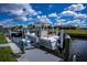Private boat dock with lift offers convenient access to the water, ideal for boating enthusiasts at 129 Barre Nw Dr, Port Charlotte, FL 33952
