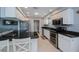 Well-equipped kitchen with stainless steel appliances, granite countertops, and ample cabinet space at 129 Barre Nw Dr, Port Charlotte, FL 33952