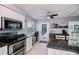 Modern kitchen boasting granite countertops, stainless steel appliances, and an adjacent dining area at 129 Barre Nw Dr, Port Charlotte, FL 33952