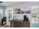 Bright kitchen area with a view of the outdoor pool area and unique decor at 129 Barre Nw Dr, Port Charlotte, FL 33952