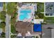 Birds-eye view of the community pool, clubhouse, and outdoor areas at 13049 Creekside Ln, Port Charlotte, FL 33953
