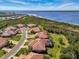 Expansive aerial view features attractive homes with lush landscaping near a beautiful body of water at 13049 Creekside Ln, Port Charlotte, FL 33953