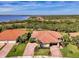 Scenic aerial perspective of residential homes with neat landscaping and brick driveways by the water at 13049 Creekside Ln, Port Charlotte, FL 33953