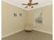 Comfortable bedroom with a chair, window, and neutral color palette at 13049 Creekside Ln, Port Charlotte, FL 33953
