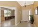 Inviting foyer with an office featuring lots of natural light at 13049 Creekside Ln, Port Charlotte, FL 33953