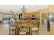 Open kitchen and dining area with natural wood cabinets and modern appliances at 13049 Creekside Ln, Port Charlotte, FL 33953