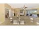 Kitchen featuring granite countertops, stainless appliances and breakfast bar seating open to the rest of the house at 13049 Creekside Ln, Port Charlotte, FL 33953