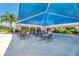 Inviting outdoor seating area provides ample space for relaxing and socializing in this community at 13049 Creekside Ln, Port Charlotte, FL 33953