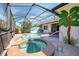 Screened-in pool area featuring both a pool and hot tub with patio space at 13049 Creekside Ln, Port Charlotte, FL 33953