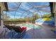Sparkling screened pool with lounge chairs for relaxing poolside at 13049 Creekside Ln, Port Charlotte, FL 33953