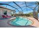 Enclosed pool with sun loungers and access steps providing relaxing outdoor space at 13049 Creekside Ln, Port Charlotte, FL 33953