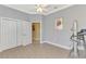 Bright workout room with exercise equipment, closet, and a doorway to adjoining room at 13049 Creekside Ln, Port Charlotte, FL 33953