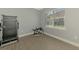 Bright workout room with exercise equipment and a large window at 13049 Creekside Ln, Port Charlotte, FL 33953