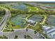 Aerial view of community amenities, showcasing tennis and pickleball courts, club house and green landscape at 14724 Cherry Blossom Way, Punta Gorda, FL 33955