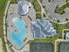 Aerial view featuring the swimming pool and clubhouse at 14724 Cherry Blossom Way, Punta Gorda, FL 33955