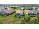 Scenic aerial view of a home with a screened pool in a community with lake views at 14724 Cherry Blossom Way, Punta Gorda, FL 33955