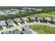 Aerial view of a home in a beautiful community with a golf course and several ponds at 14724 Cherry Blossom Way, Punta Gorda, FL 33955