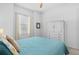 Bright bedroom features coastal decor, a ceiling fan, and a storage cabinet at 14724 Cherry Blossom Way, Punta Gorda, FL 33955