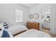 Bright bedroom features two twin beds and carpeted flooring at 14724 Cherry Blossom Way, Punta Gorda, FL 33955