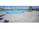 Expansive community pool with ample seating and a luxurious, resort-like atmosphere at 14724 Cherry Blossom Way, Punta Gorda, FL 33955
