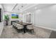 Bright conference room with a spacious table, seating for ten, and contemporary decor at 14724 Cherry Blossom Way, Punta Gorda, FL 33955
