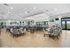 Bright community dining area features tables, chairs, and a bar, perfect for gatherings and socializing at 14724 Cherry Blossom Way, Punta Gorda, FL 33955