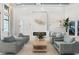 An elegant community clubhouse lobby with stylish seating, modern fireplace, and abundant natural light at 14724 Cherry Blossom Way, Punta Gorda, FL 33955