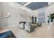 An elegant community clubhouse lobby with a modern fireplace, stylish seating, and high ceilings at 14724 Cherry Blossom Way, Punta Gorda, FL 33955