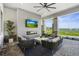 Relaxing outdoor lounge featuring plush seating, a fireplace, and scenic views of the surrounding landscape at 14724 Cherry Blossom Way, Punta Gorda, FL 33955