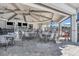 Inviting outdoor patio with tables, chairs, and views, ideal for dining and entertaining at 14724 Cherry Blossom Way, Punta Gorda, FL 33955