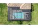 Aerial view of a private screened-in pool and spa with brick pavers in the backyard at 14724 Cherry Blossom Way, Punta Gorda, FL 33955