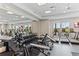 Bright community gym featuring multiple treadmills, weights, and a mirrored wall at 16408 Bridle Ridge St, Port Charlotte, FL 33953