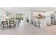 Open floor plan with kitchen, dining area, and living room, perfect for entertaining and Gathering living at 16408 Bridle Ridge St, Port Charlotte, FL 33953
