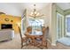 Cozy dining area with view to the lanai and living room at 1715 Queen Palm Way, North Port, FL 34288