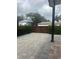 Backyard shot with a paver patio and wooden gate at 2031 Basin St, Port Charlotte, FL 33952