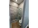 Nicely tiled shower featuring river rock floor and a sliding glass door at 2031 Basin St, Port Charlotte, FL 33952
