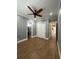 Bedroom featuring tile flooring, ceiling fan, closet, and gray colored walls at 2031 Basin St, Port Charlotte, FL 33952