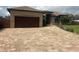 Long driveway with pavers leading to the garage of the house at 2031 Basin St, Port Charlotte, FL 33952