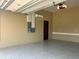 Clean epoxy floor in the garage has new paint and is climate-controlled at 2031 Basin St, Port Charlotte, FL 33952